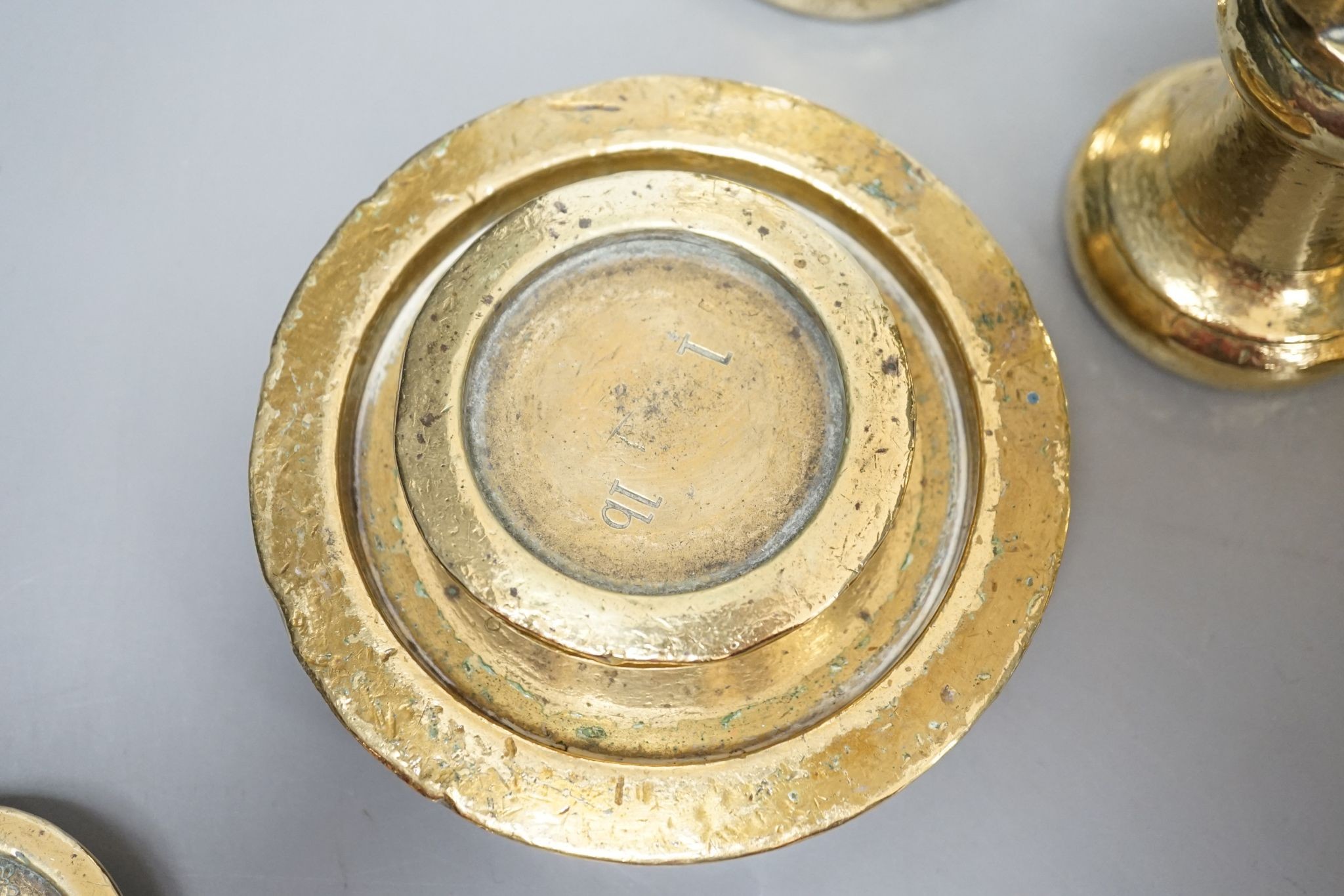 A set of 5 Victorian graduated cast brass bell weights and 3 graduated cast brass disc weights (8) 18cm